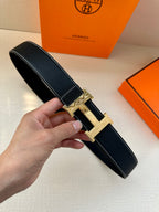 Hermes leather belt, dark navy textured strap, silver H buckle with pin closure