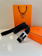 Hermes leather belt, dark navy strap with silver H buckle and wide leather keeper