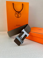 Gray leather belt with silver-tone H buckle and textured leather