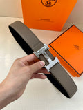 Gray leather belt with silver-tone H buckle and textured finish