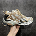 Unisex high-top sneakers in white, tan, and gold with lace-up closure