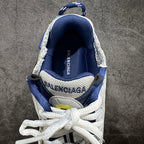 Navy and white sneakers with white laces, rear collar, and logo lettering