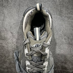 Gray and white sneaker interior and laces visible, with cushioned collar lining