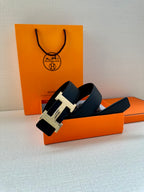 Black leather belt with silver-tone H buckle, side profile