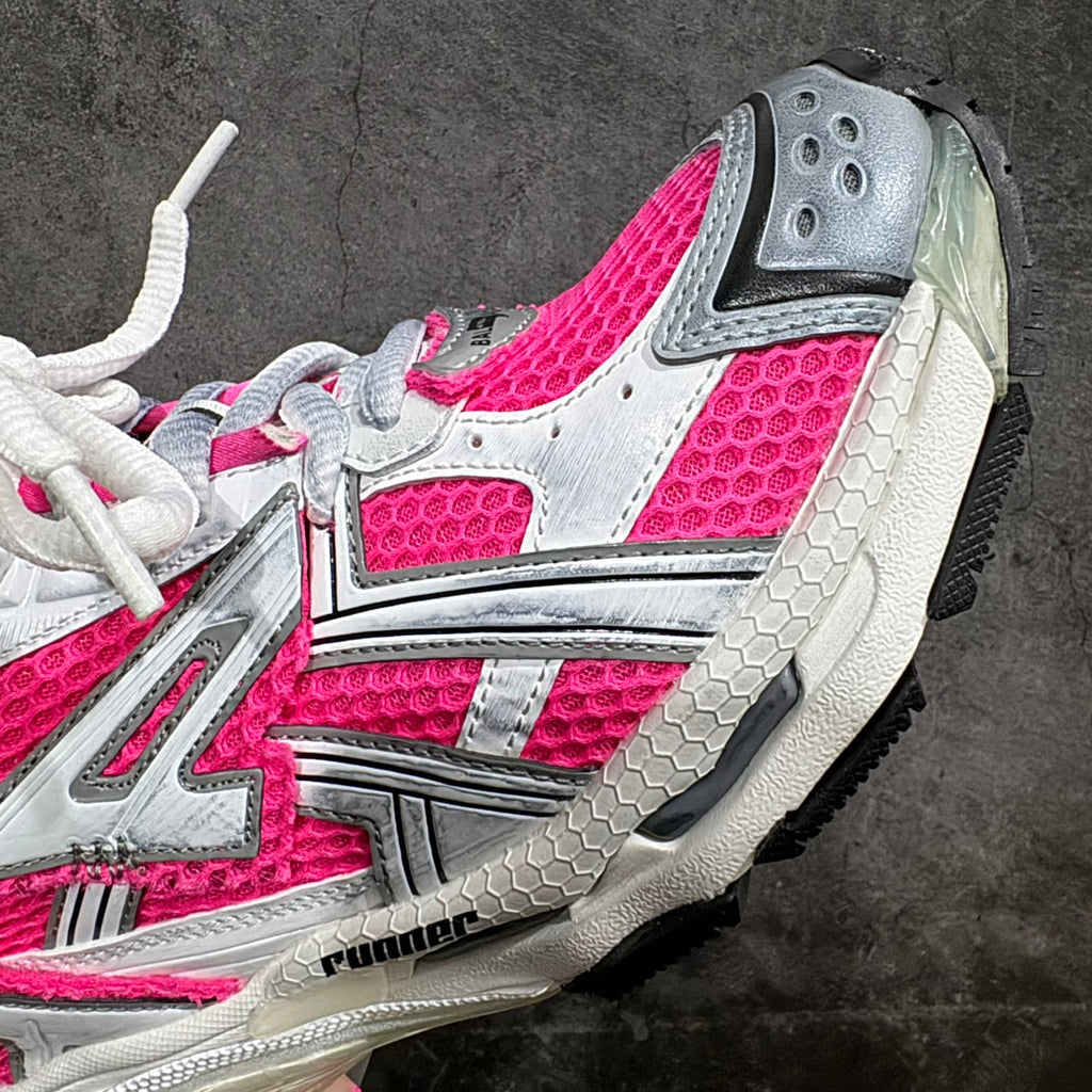 Pink and white unisex sneaker upper close-up with mesh panels and silver side detail