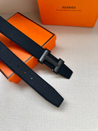 Hermes belt set: dark leather strap with silver-toned buckle and two belt holes.