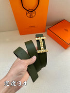 Hermes belt dark green leather with silver-tone studded H buckle, showing end and holes