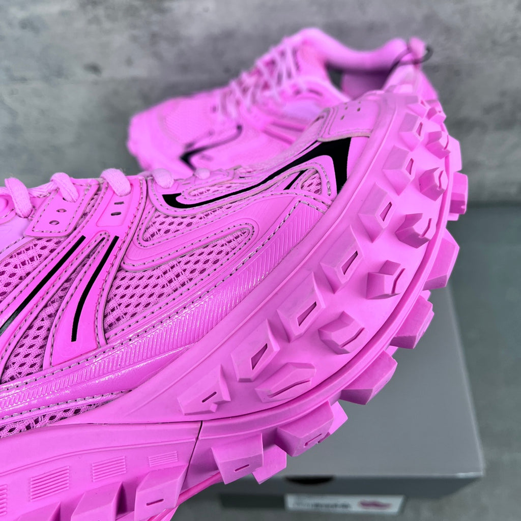 Balenciaga unisex sneakers close-up: bright pink mesh upper with black logo stripe