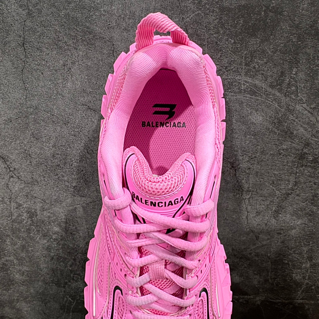 Pink lace-up sneaker with rear collar branding and padded heel