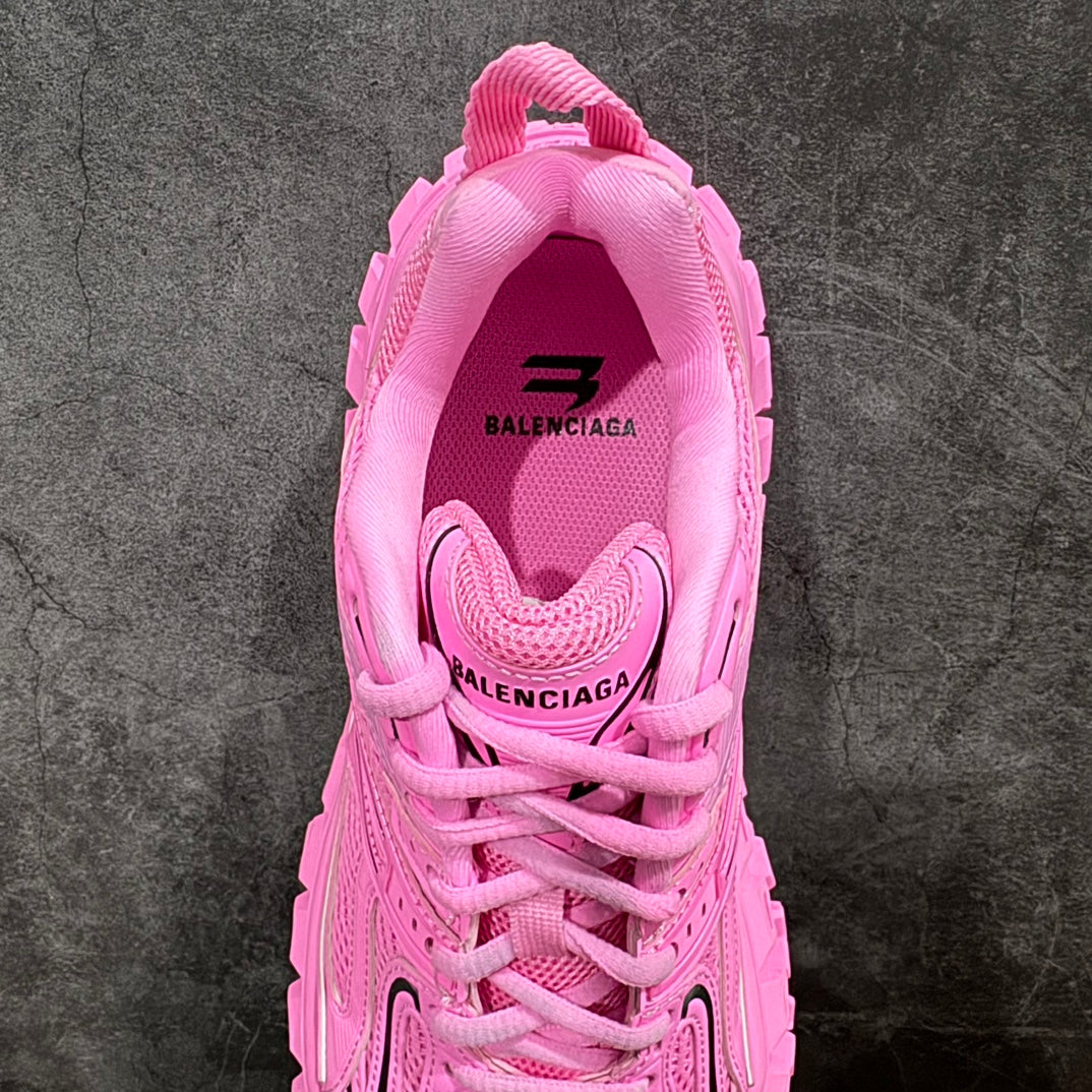 Pink lace-up sneaker with rear collar branding and padded heel