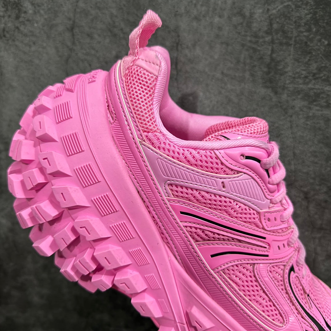 Pink sneaker outsole and side lacing, thick tread with geometric blocks