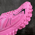 Pink lace-up sneaker showing side panel details and thick lug sole