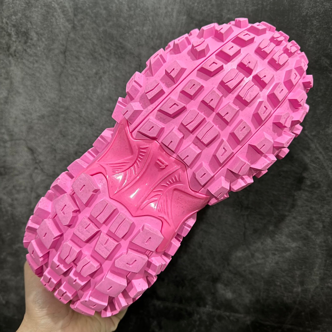 Pink sneaker bottom outsole with deep geometric tread and traction lugs