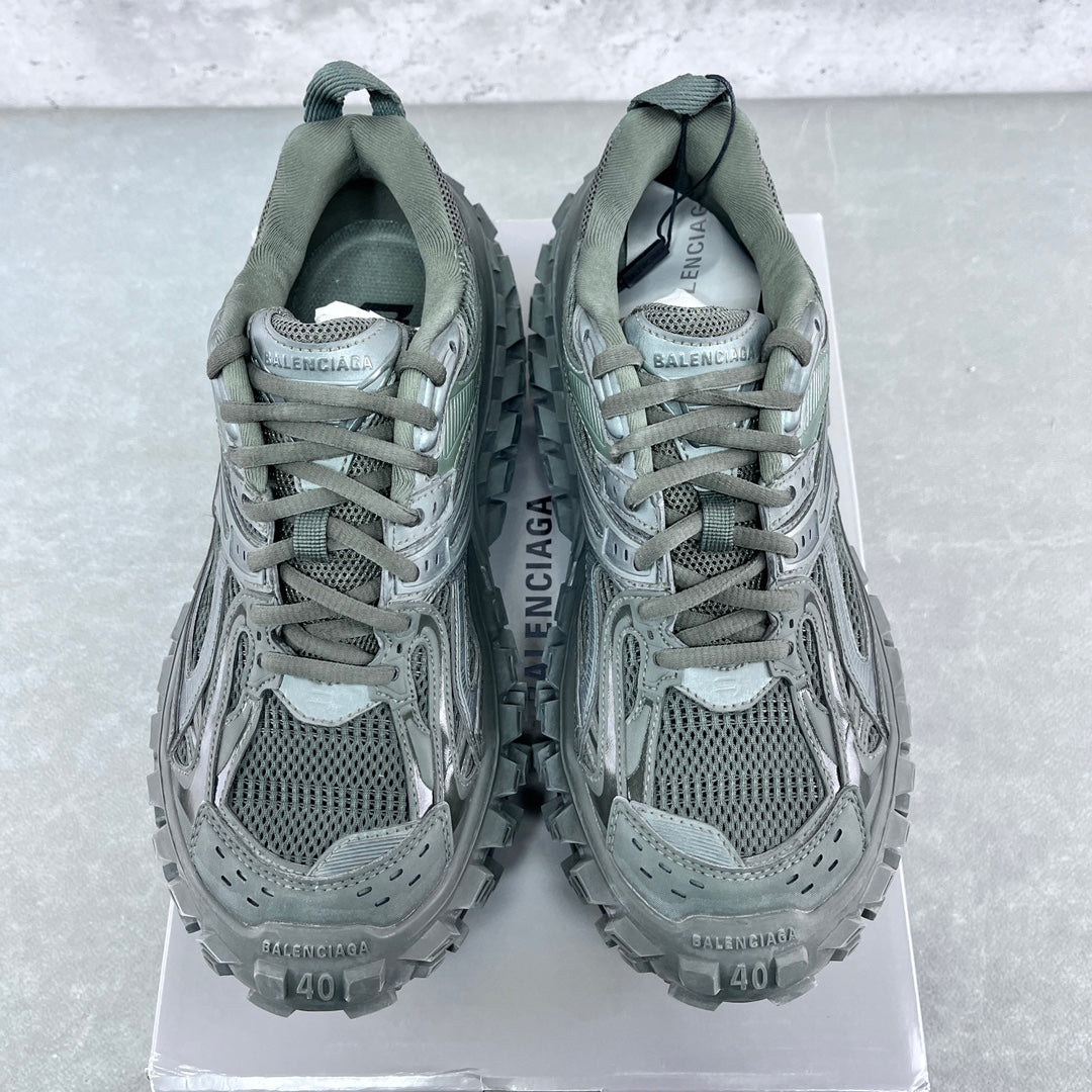 Balenciaga unisex trail shoes with padded collars, lace-up mesh uppers, muted green.