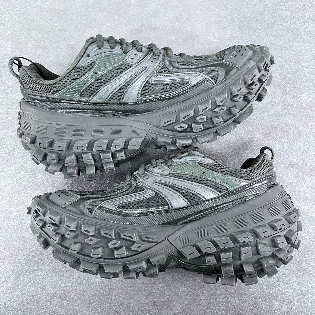 Balenciaga unisex trail shoes with chunky lug soles and lace-up mesh uppers, muted green.