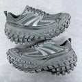 Balenciaga unisex trail shoes in muted green with thick rubber lug soles.