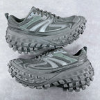 Balenciaga unisex trail shoes in muted green with thick rubber lug soles.