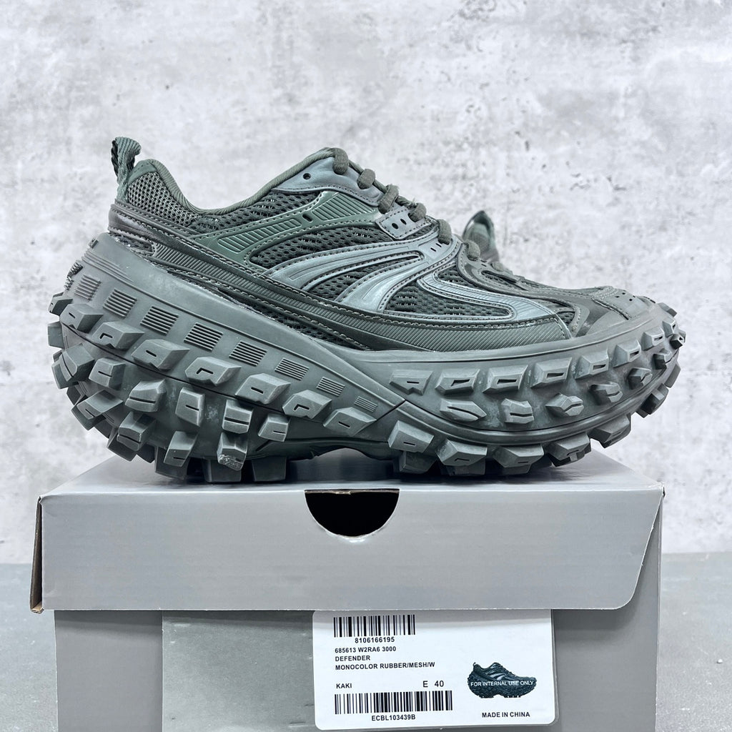 Balenciaga unisex lace-up trail shoes with deep lug outsoles, muted green.