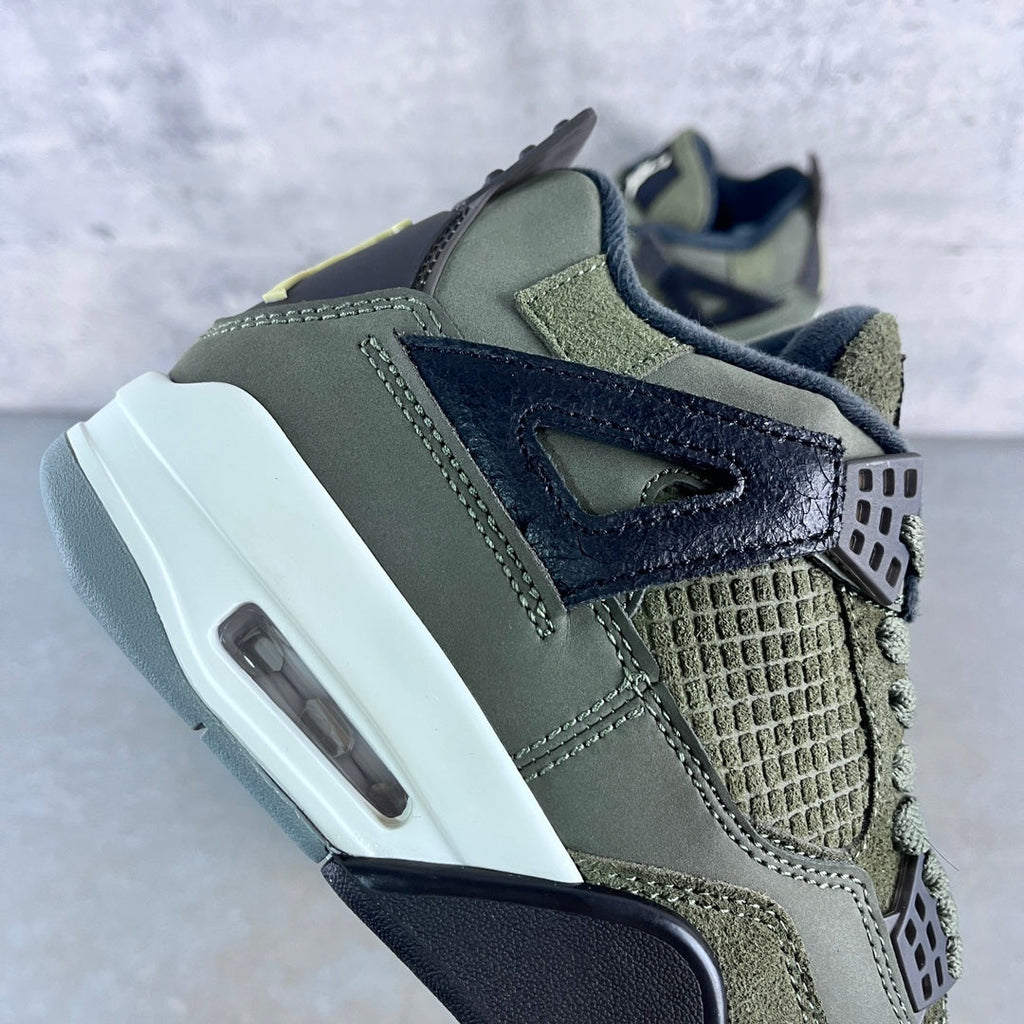 Olive high-top sneaker with navy side panel, textured toe, and white Air midsole