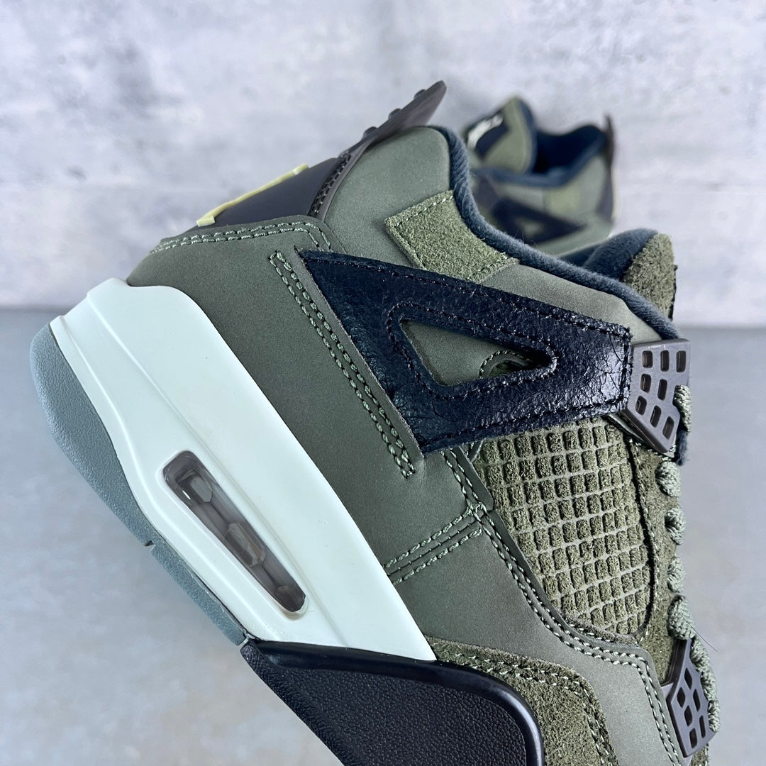 Olive high-top sneaker with navy side panel, textured toe, and white Air midsole