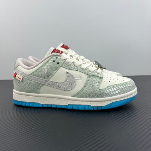 Seafoam and white low-top sneakers with blue outsole, white laces, and Nike swoosh