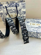 Dior belt with black-and-blue logo pattern strap and round buckle hardware