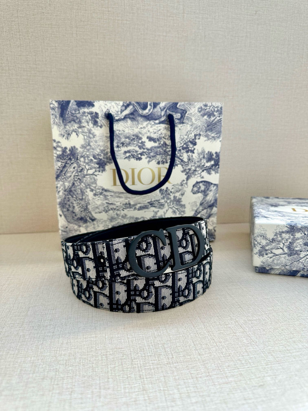 Dior belt in black-and-blue monogram fabric with dark round Dior buckle
