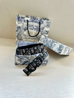 Dior belt with black-and-blue repeating logo strap and dark buckle