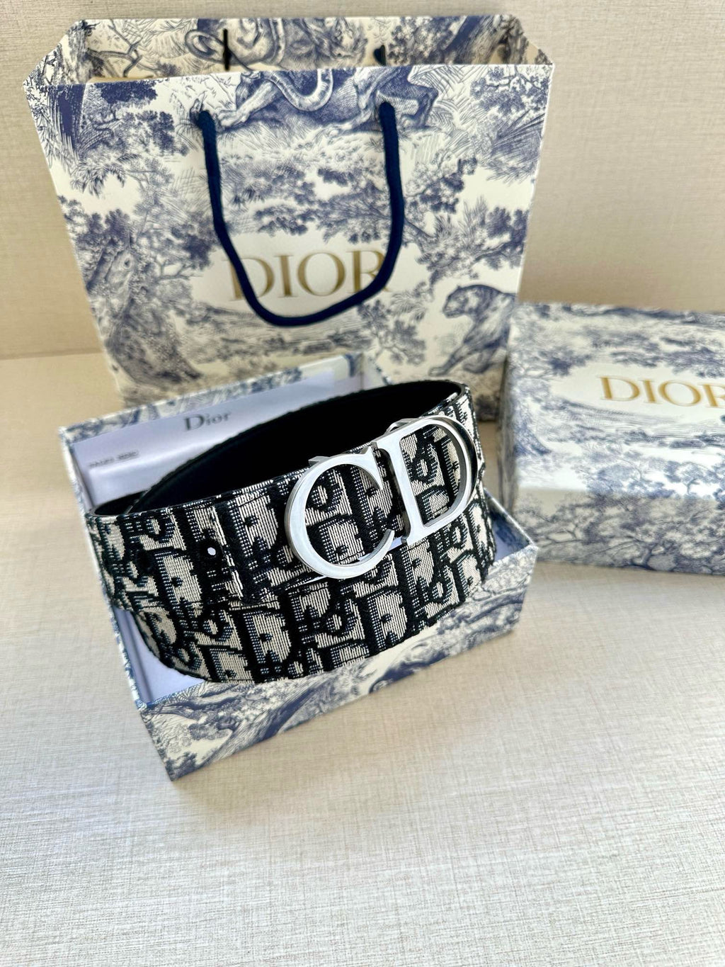 Designer belt with black Dior monogram jacquard strap and oversized silver buckle