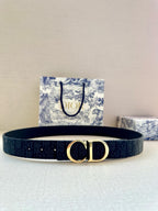 Navy leather belt with CD gold-tone buckle, monogram print.