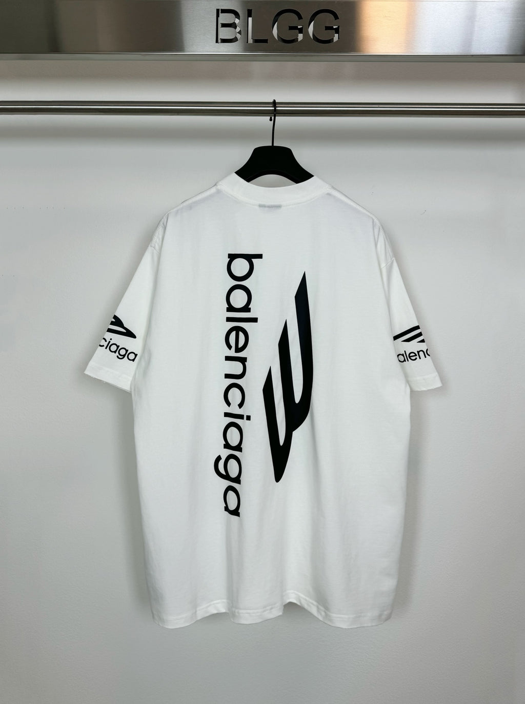 White Balenciaga T-shirt with large vertical 'balenciaga' logo graphic on back