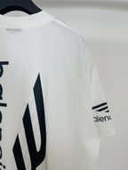 White Balenciaga T-shirt with 'alenc' sleeve logo and large back icon detail