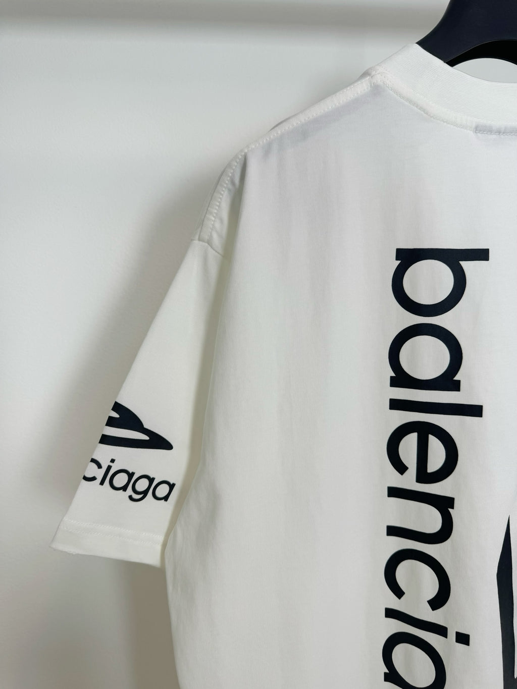 White Balenciaga T-shirt sleeve logo with 'balenciaga' back text detail
