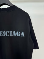Dark Balenciaga T-shirt back/side detail with large logo lettering