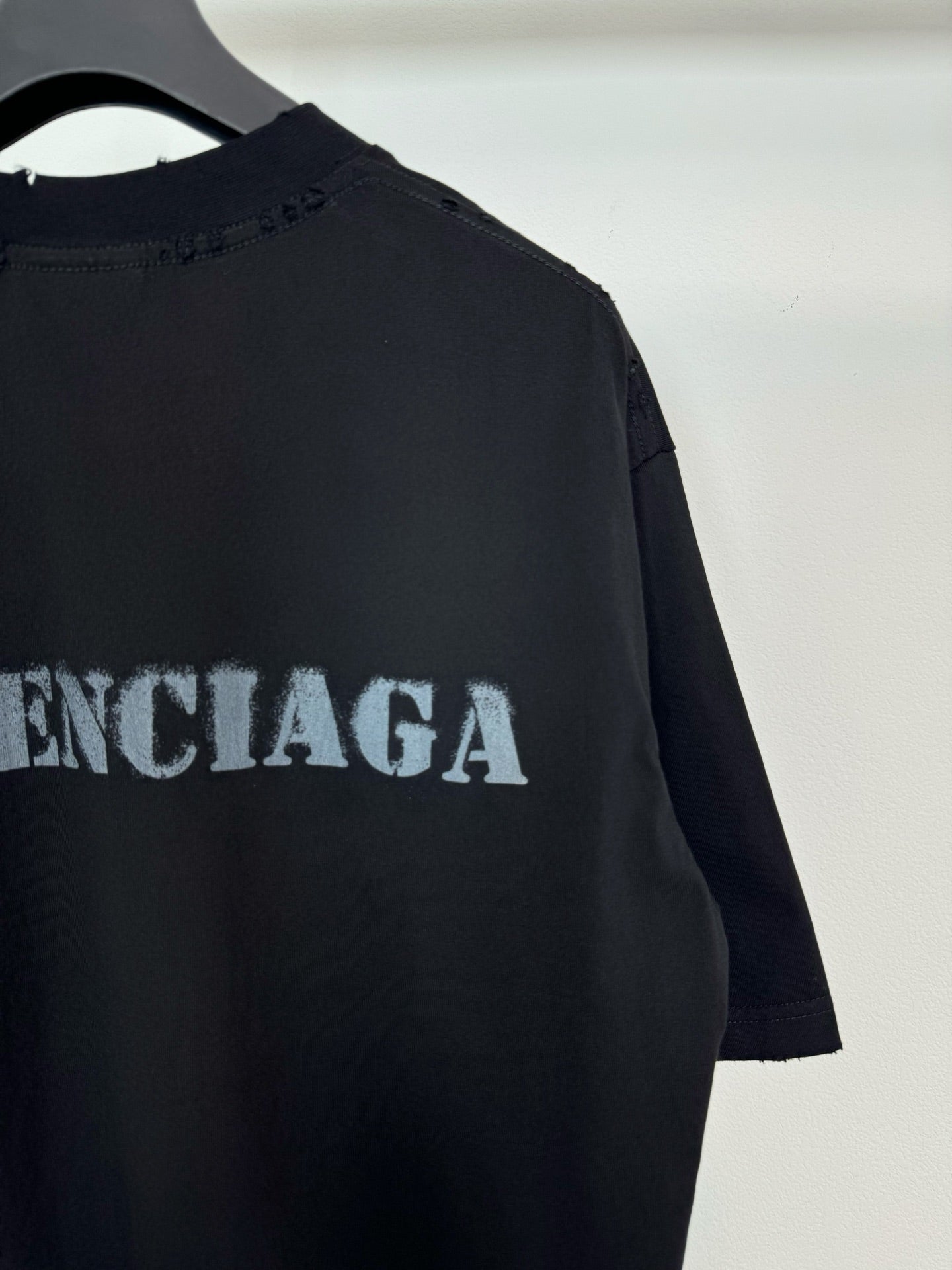 Dark Balenciaga T-shirt back/side detail with large logo lettering