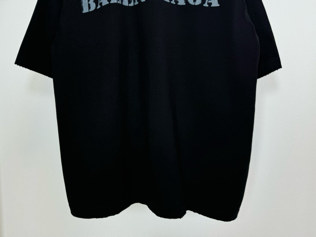 Dark Balenciaga T-shirt hem view with curved bottom and short sleeves