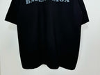 Dark Balenciaga T-shirt hem view with curved bottom and short sleeves