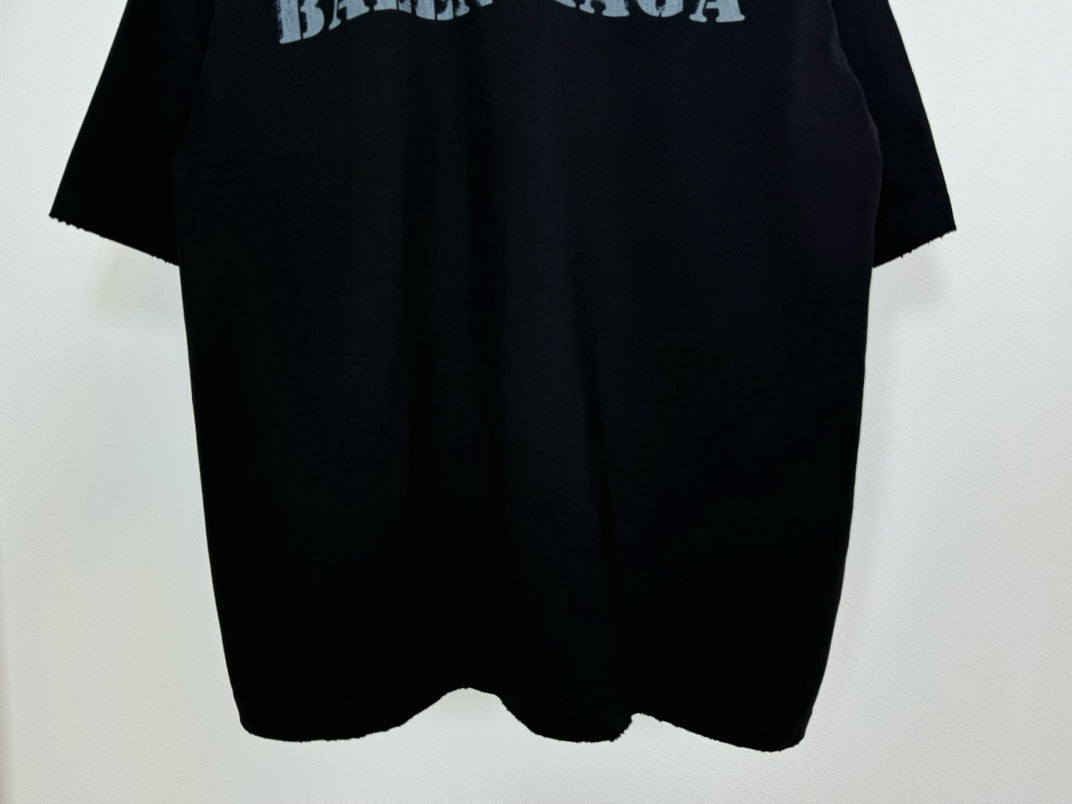 Dark Balenciaga T-shirt hem view with curved bottom and short sleeves