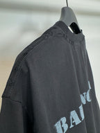 Dark Balenciaga T-shirt side view on hanger, stitched neckline and sleeve edge