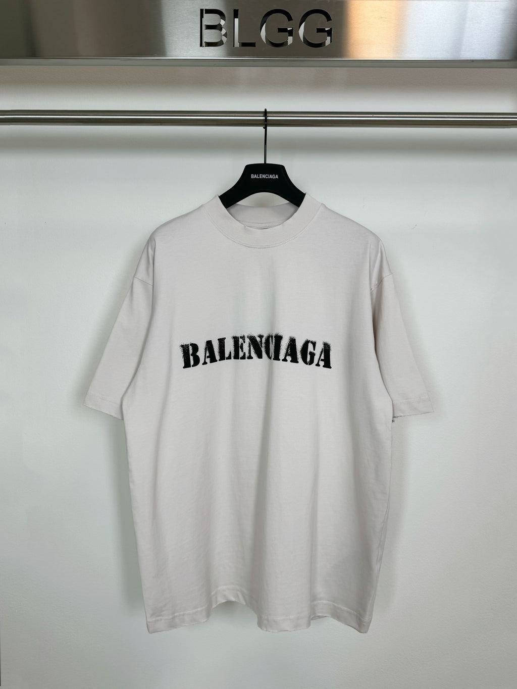 White short-sleeve T-shirt with black BALENCIAGA logo on the chest