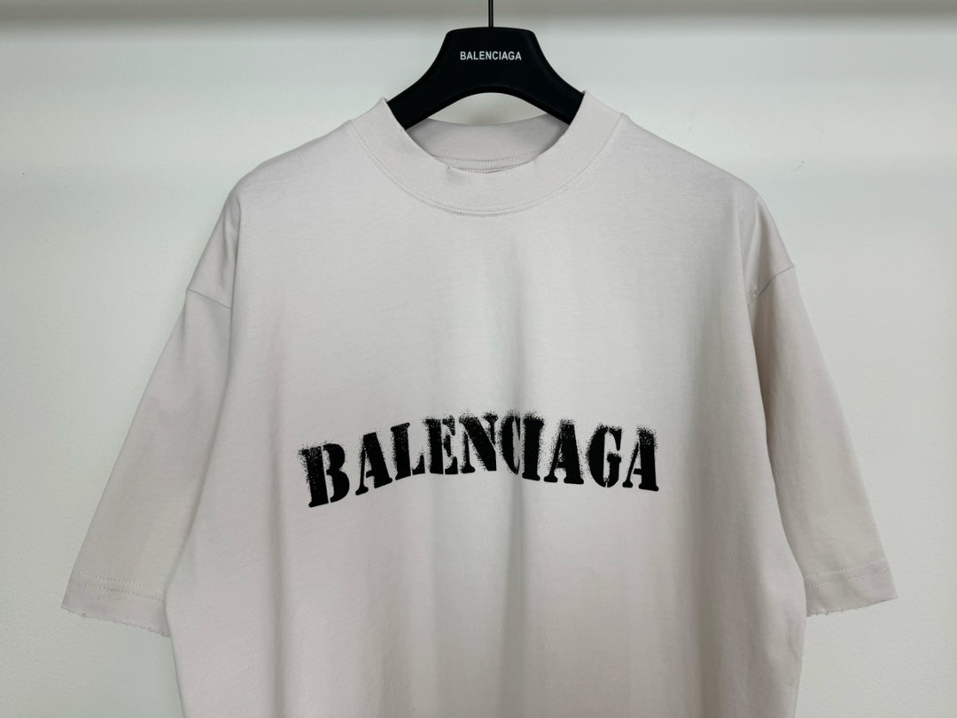 White short-sleeve T-shirt with black BALENCIAGA logo centered on the chest