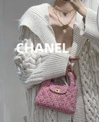Layered necklaces with Chanel charms, gold-tone chains and pearl beads