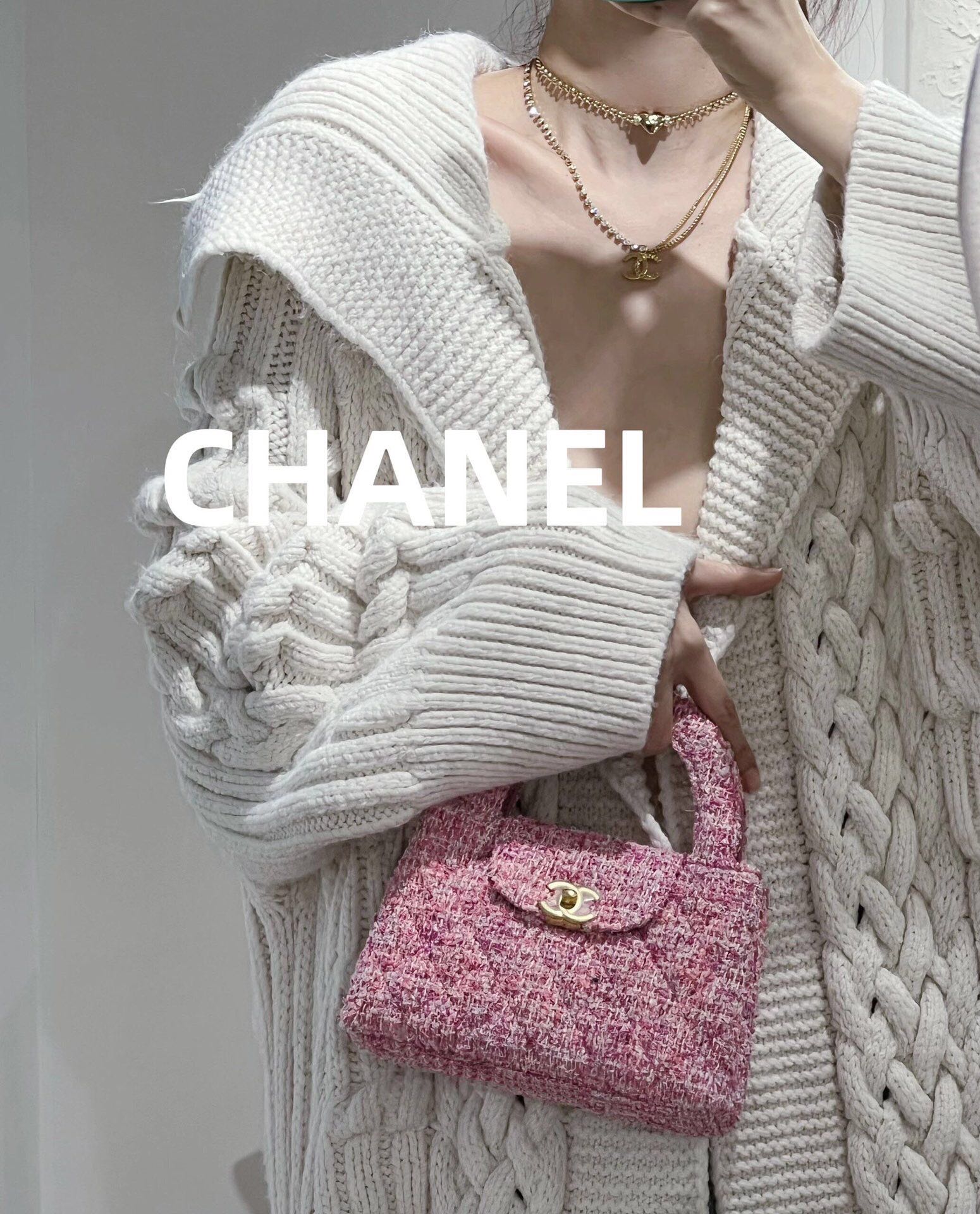 Layered necklaces with Chanel charms, gold-tone chains and pearl beads