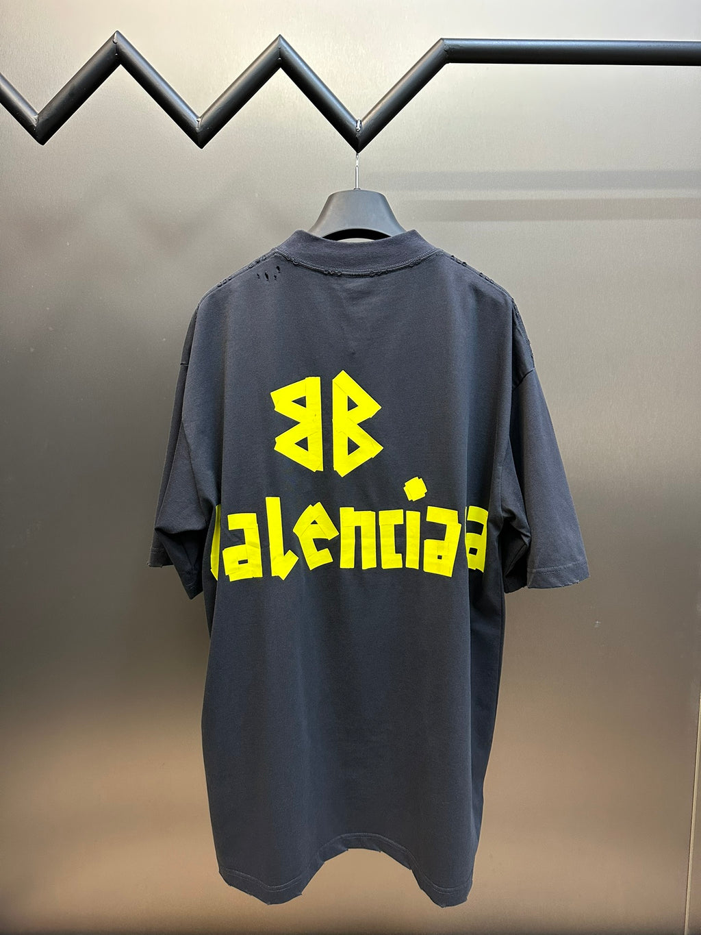 Dark blue Balenciaga T-shirt, back view, with yellow AB and BALENCIAGA graphic.