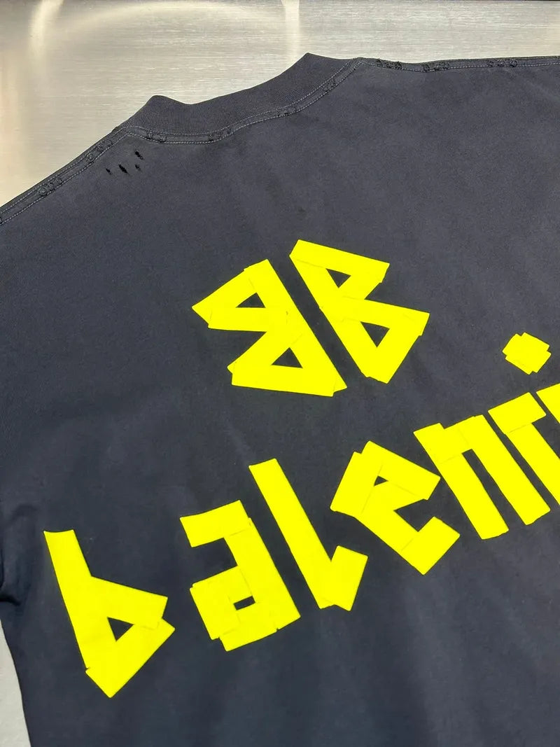 Navy Balenciaga short-sleeve top close-up of back logo print in neon yellow