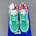 Seafoam sneakers with green laces, red gingham lining at heel, and Nike SB tag