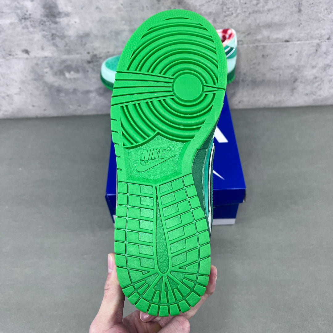 Bright green sneaker outsole and heel with Nike logo and tread pattern