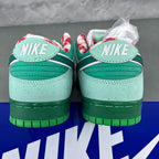 Back view of seafoam sneakers with green heel panels and NIKE text