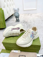 Gucci unisex sneakers, cream with colorful cartoon patch on the side and white laces