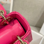 Pink bag opening with smooth leather lining and gold ring handle hardware